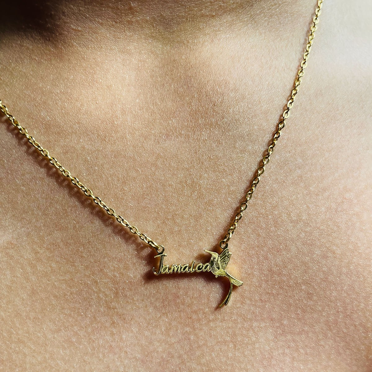 Jamaica hummingbird necklace worn close to the heart